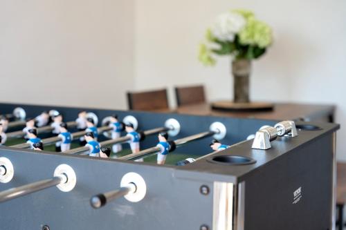 a row of blue figurines sitting on top of a machine at Chic Colchester Flat in Colchester