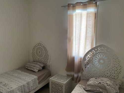 Postel nebo postele na pokoji v ubytování Maison de charme ⵣ