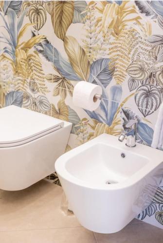 a bathroom with a toilet and a sink at B&B Terre del cretto in Nuova Gibellina