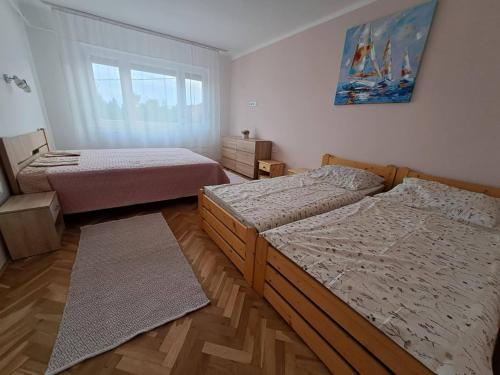 Postel nebo postele na pokoji v ubytování Anna Apartman