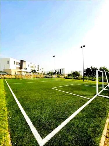 an empty soccer field with a goal on it at 2 minutes de la plage , Résidence Tamourrit, Taghazout Bay , vue mer , golf , piscine in Taghazout