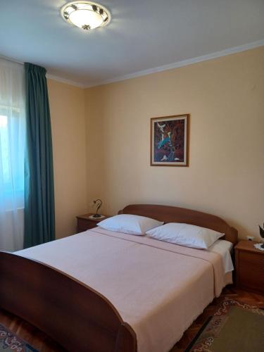 Postel nebo postele na pokoji v ubytování Apartments Stana