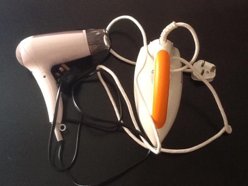 a hair dryer with a carrot sticking out of it at HP Vacation Marina Court in Kota Kinabalu