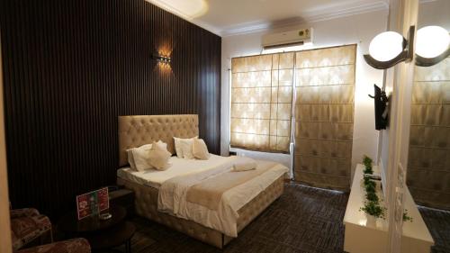 Postel nebo postele na pokoji v ubytování Hotel Kuber