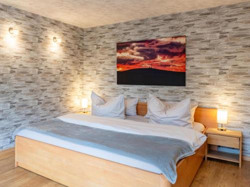 a bedroom with a large bed with two night stands at Harzträume No1 # Parkplatz # Altstadt # Brockenbahn in Wernigerode