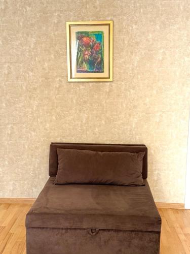 a painting on a wall above a bed in a room at Private House , in the middle of the city, in 10 min. To Fabrika in Tbilisi City