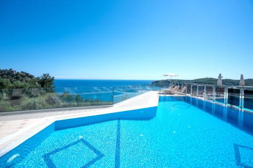 a swimming pool with a view of the ocean at Valtos View in Parga