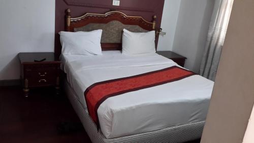 Postel nebo postele na pokoji v ubytování Kk Hotel