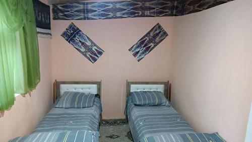 Katil atau katil-katil dalam bilik di Aslon Guest House