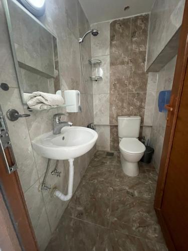 a bathroom with a sink and a toilet at Teras in Seferihisar