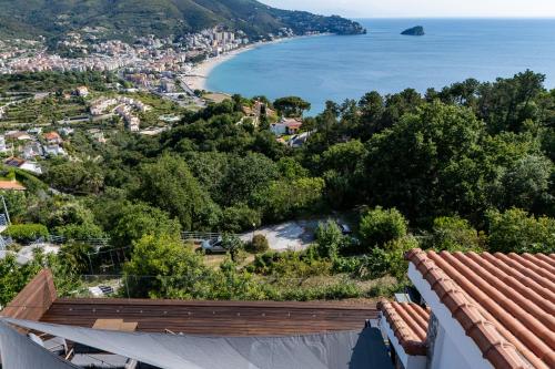 a view from the roof of a house overlooking a beach at Spettacolare vista isola Terrazza e idromassaggio in Noli