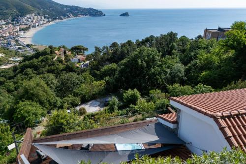 a view of the beach from a house at Spettacolare vista isola Terrazza e idromassaggio in Noli