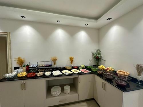 a buffet line with many different types of food at Bloomtalya Hotel in Antalya
