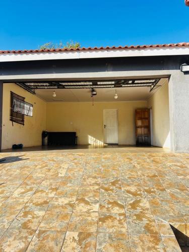 a large empty garage with a large stone floor at The Barberton Nest in Barberton