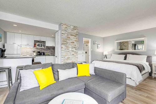 a living room with a couch and a bed at Blue Mountain Hideaway at North Creek Resort in Blue Mountains