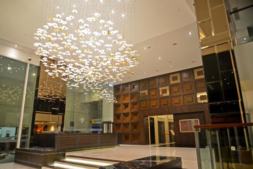 a large chandelier hanging from the ceiling in a building at Verdant Hill Hotel Kuala Lumpur in Kuala Lumpur