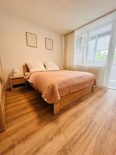 Ένα ή περισσότερα κρεβάτια σε δωμάτιο στο Apartman NovumSpot