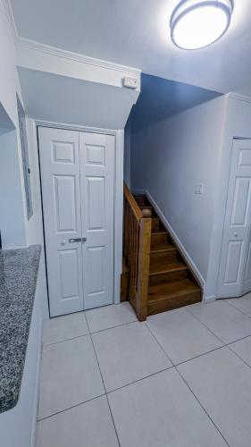 a room with a staircase and a door and a stair case at MoBay Las Palmas in Montego Bay
