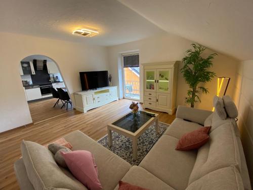 a living room with a couch and a table at Golger APP in Obervellach