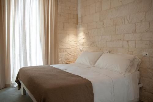 Postel nebo postele na pokoji v ubytování Palazzo Marconi