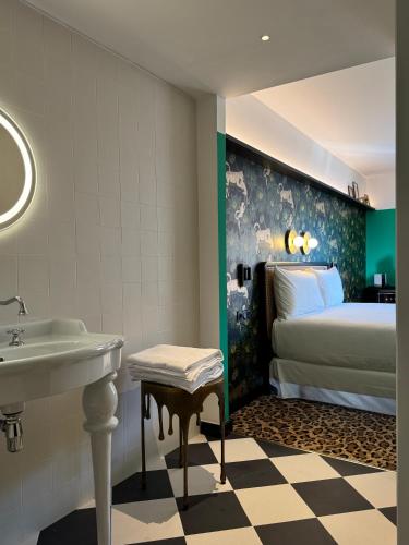 Un ou plusieurs lits dans un hébergement de l'établissement Hotel Divino & Aparthotel