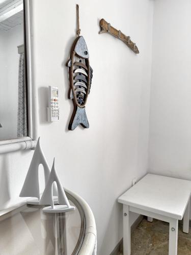 a room with a table and a skeleton on the wall at The Traditional Stone Villa in Koundouros
