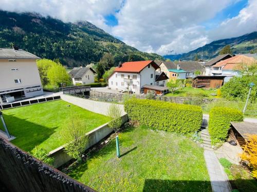 a view of a village with houses and a yard at Golger APP in Obervellach
