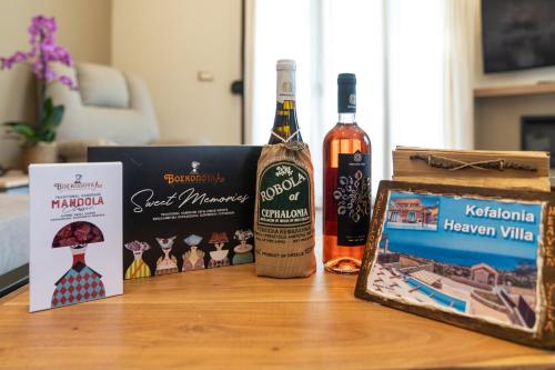 a bottle of wine and a box on a table at Kefalonia Heaven Villa in Vlachata