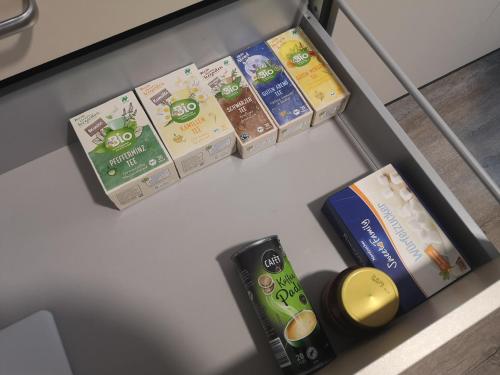 a drawer filled with milk and other food items at Happy Place Apartment XXL in Braunschweig