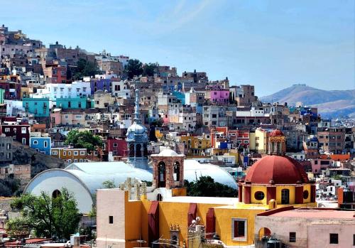 a view of a city with many buildings at El Meson de los Poetas in Guanajuato