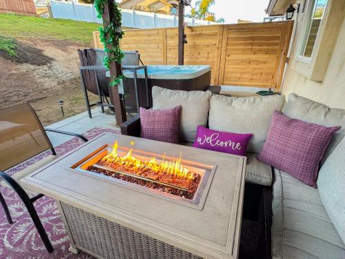 a fire pit sitting on top of a couch at Amethyst Hearth - Family Spa Serenity, Zoo, Beach, Disneyland, Legoland in Vista