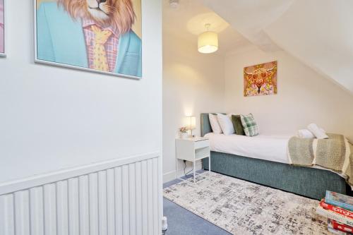 a bedroom with a bed in a attic at Luxury 4-Bed Family Home in Epping with Parking by LMV Property in Epping