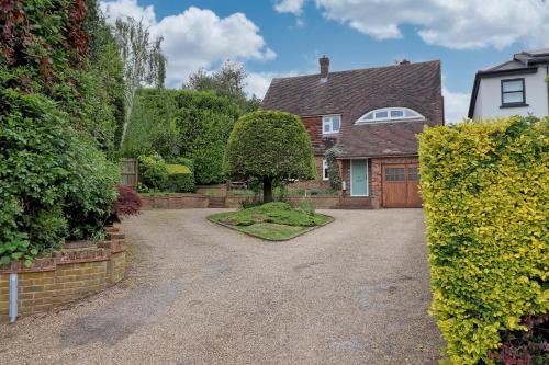 a driveway in front of a house with a garage at Luxury 4-Bed Family Home in Epping with Parking by LMV Property in Epping