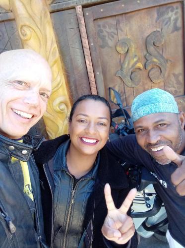two men and a woman giving the thumbs up at EBORA Afro Cultural in Ilhéus