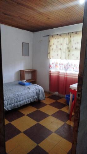 Postel nebo postele na pokoji v ubytování Hostal Mama Julia