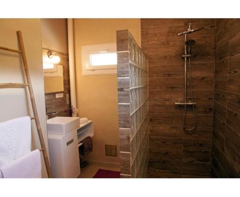 a bathroom with a shower and a toilet and a sink at Logis Hôtel Restaurant L'Escapade in Le Crestet