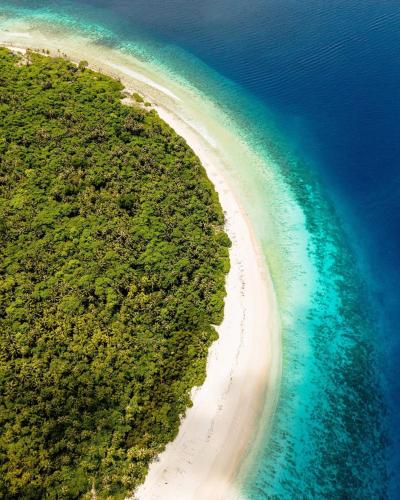 an aerial view of a beach and the ocean at Handhuvaru Maldives in Milandu