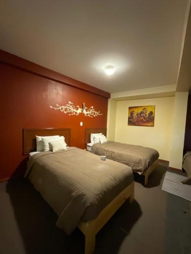 Postel nebo postele na pokoji v ubytování Hotel Andean Host Inn