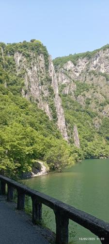 a body of water in front of a mountain at Casa Caterina - Riva di Solto - Iseo Lake in Riva di Solto