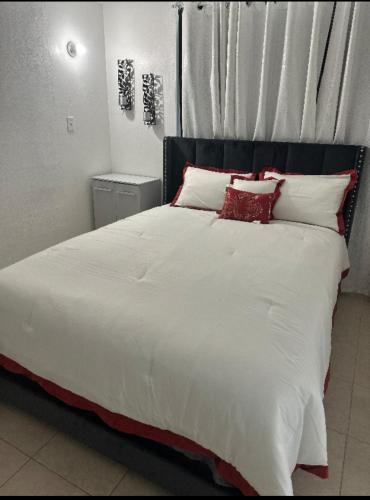 Llit o llits en una habitació de Light Guest fajardo