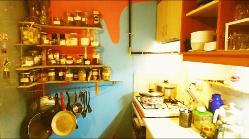 a kitchen with pots and pans on the counter at Shantihome in İzmir