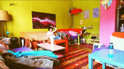 a girl standing on a table in a living room at Shantihome in Izmir