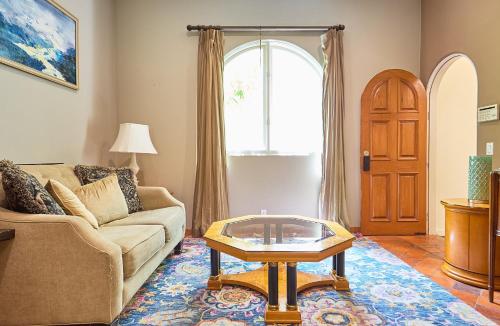 a living room with a couch and a table at Beverly Hills Spanish in Los Angeles