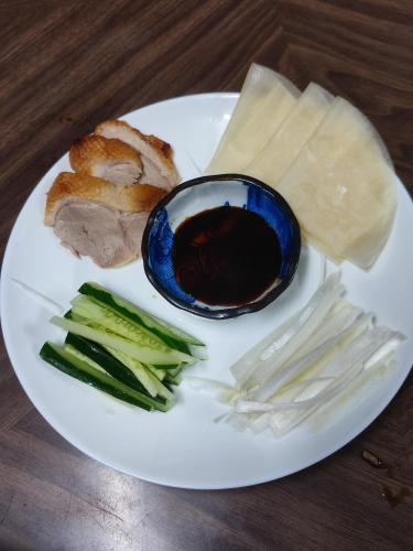 a plate of food with meat and vegetables on a table at 北軽井沢 あさま1155 in Tsumagoi
