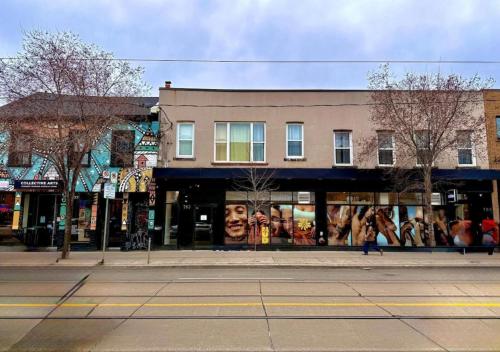 a city street with a building with a mural on it at Dragon Gate Inn in Toronto