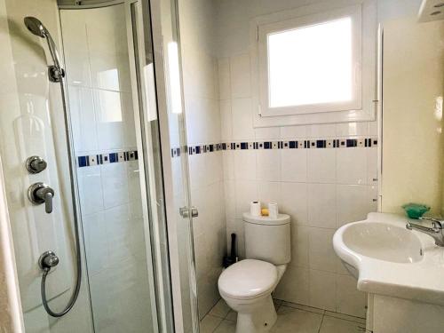 a bathroom with a toilet and a sink and a shower at La Grande Motte: Appart 2 pièces lumineux, 4 couchages, parking privé - FR-1-790-35 in La Grande-Motte
