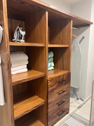 a wooden closet with wooden shelves at P V near Colomitos Beach Boutique Hotel in Puerto Vallarta
