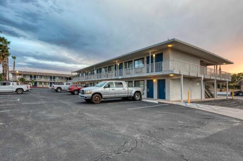 a truck parked in a parking lot in front of a building at Motel 6-Nogales, AZ - Mariposa Road in Nogales