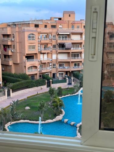a view of a large building from a window at Compound mroge elshikh zayed in Cairo