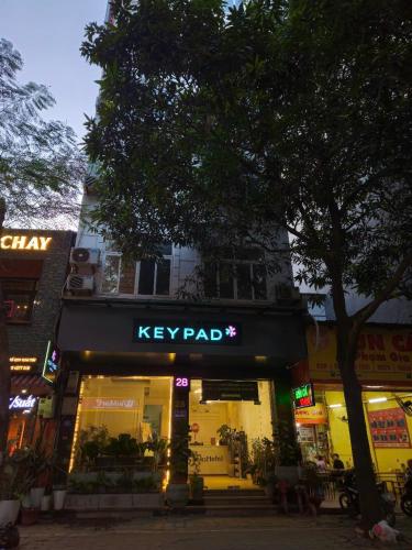 a key pad store on a city street at night at Keypad Hotel - 28 Dịch Vọng Hậu in Hanoi